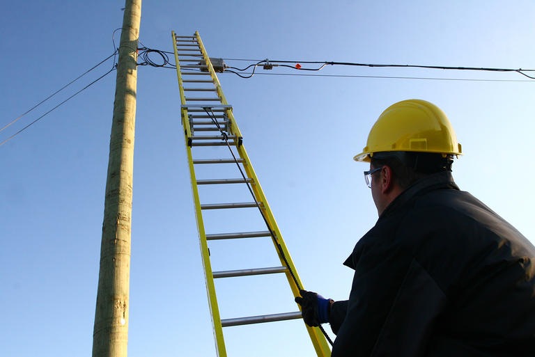 Technician with a ladder